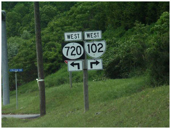 Confusing road sign showing both directions as being 'west'.